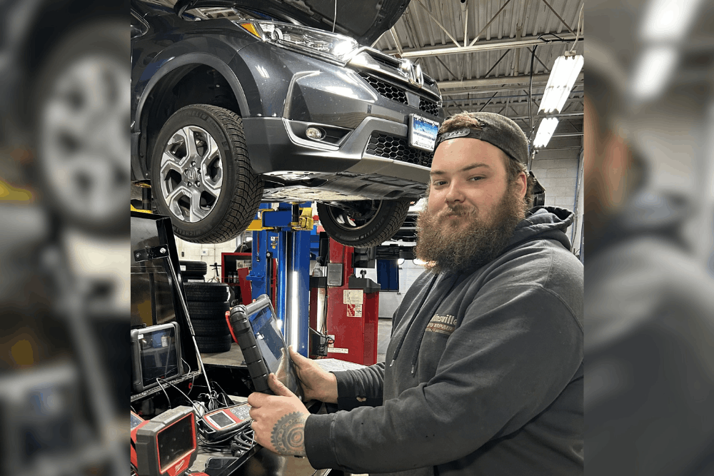 Auto diagnostics, auto repair in Canton, CT, at Collinsville Auto Repair. Image of a technician using advanced diagnostic equipment while inspecting a Honda vehicle on a lift, highlighting accurate troubleshooting, check engine light diagnostics, and professional testing to identify vehicle issues and restore reliable performance.